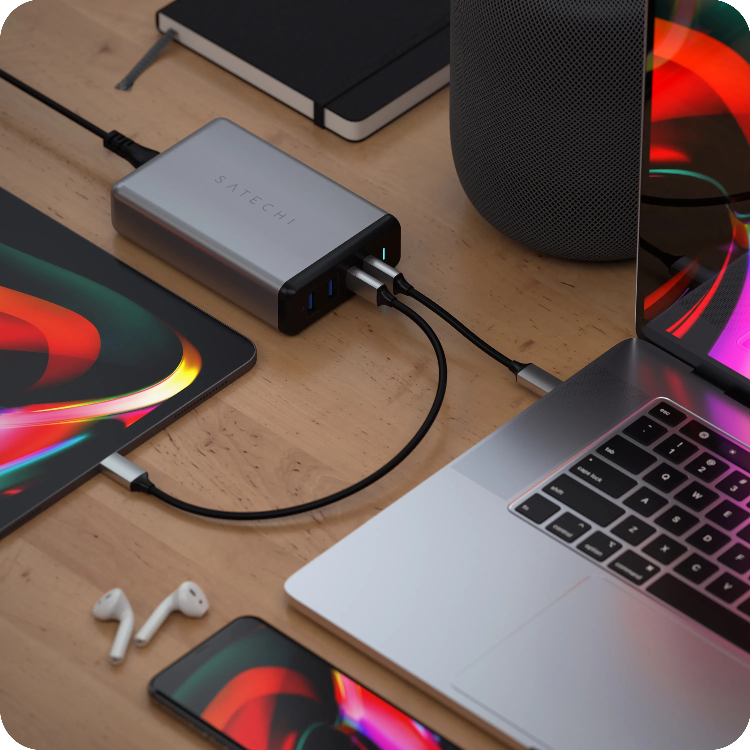 Satechi 108w pro usb-c pd desktop wall charging a MacBook Pro, an iPhone, and a iPad Pro 