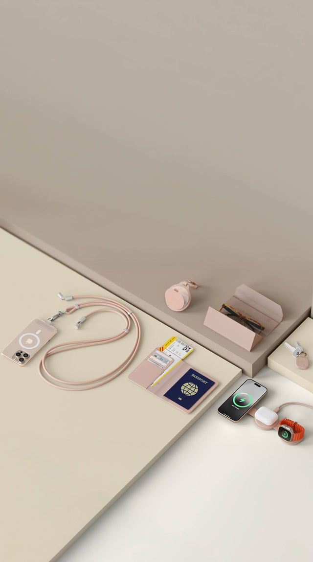 Color matched travel essentials from Satechi in Desert Rose, including the OntheGo™ USB-C Lanyard Cable, Vegan-Leather FindAll™ Passport Cover, Vegan-Leather FindAll™ Glasses Case, Vegan-Leather FindAll™ Keychain and the OntheGo™ 3-in-1 Charger powering an iPhone, AirPods and an Apple Watch.