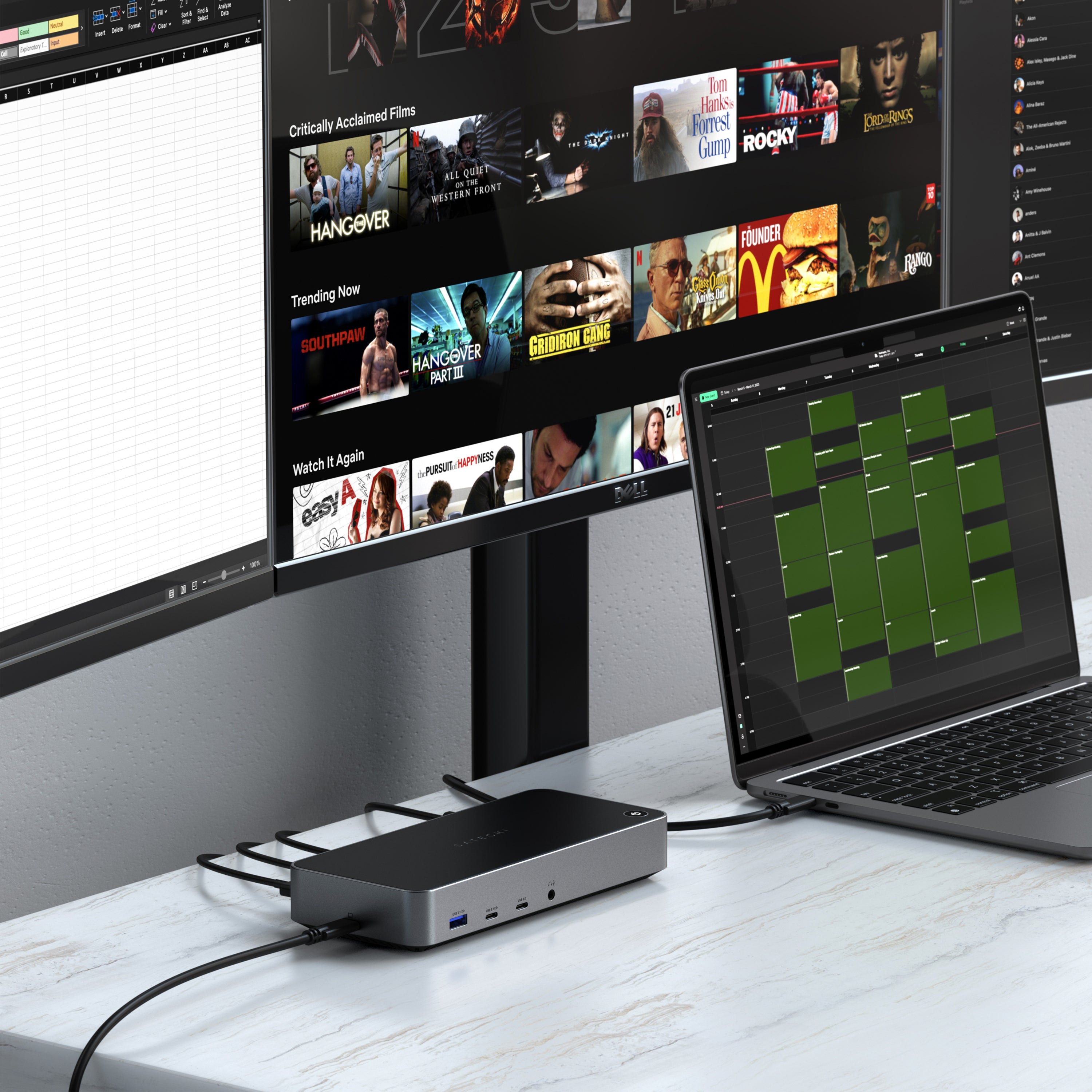 A Triple 4K Display Docking Station Satechi US sits on a white marble desk, connected to a laptop and dual monitors in a home office setup.