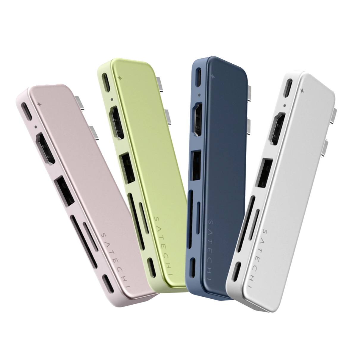 Four Satechi USB-C Snap Hub units fanned across together in Blush, Citrus, Indigo, and Silver, each slim dual-USB-C MacBook hub angled to reveal its HDMI, USB-A, USB-C, and card-reader ports and the SATECHI logo. The full color lineup of the usb c hub with hdmi.