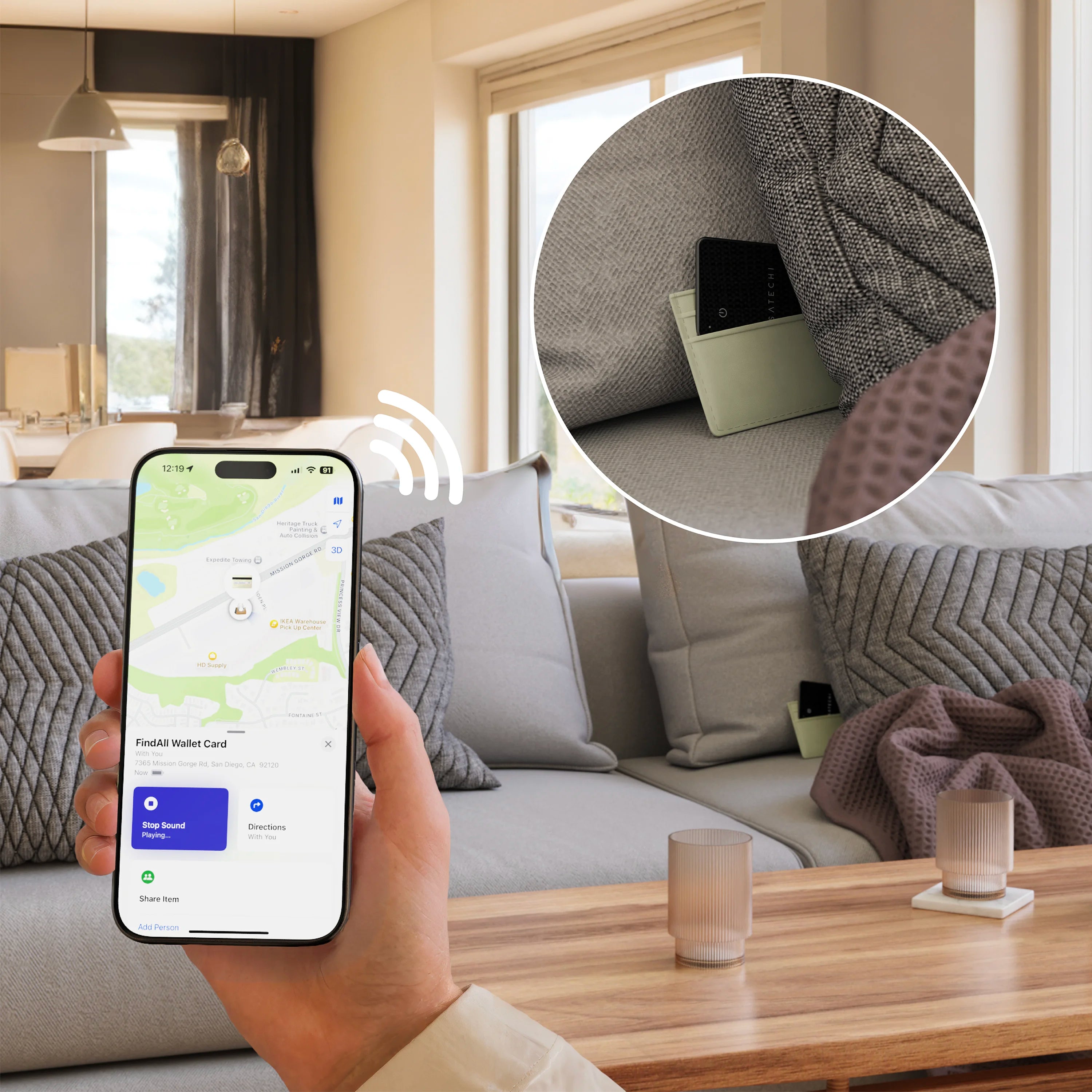 Person holding an iPhone with FindMy app on it, tracking a black FindAll™ Card
hiding in the sofa in a living room.