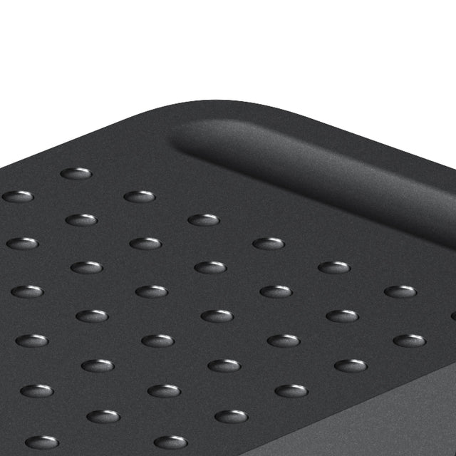 Close-up of the textured dot pattern and cable slot on the Space Black aluminum ExtendView USB4 hub.