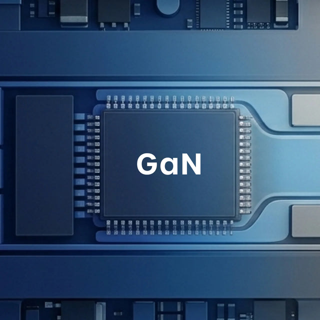 Close-up illustration of a semiconductor chip on a blue circuit board with the word "GaN" printed in white across its center, surrounded by rows of gold contact pins, copper traces, and surrounding surface-mount components — representing the GaN charger technology inside the Satechi ChargeView™ 240W Desktop Charger.