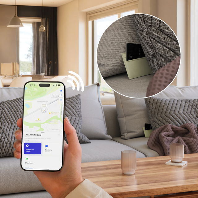 IPhone displaying the Find My app while the Satechi FindAll Card is shown tucked between couch cushions in a living room.