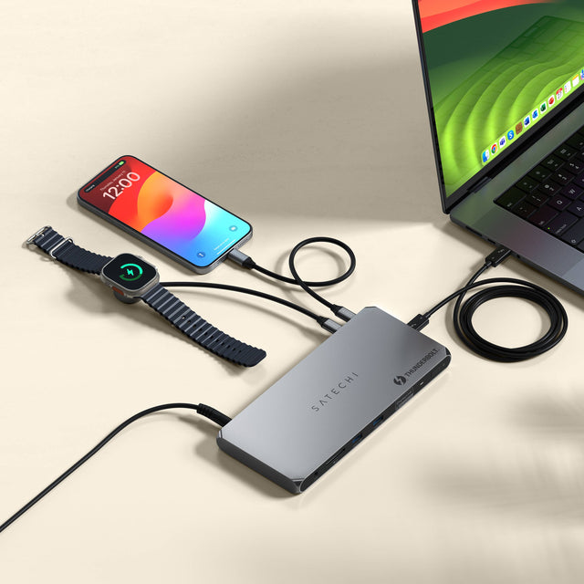 A Thunderbolt 4 Docking Station with DisplayLink connected to a laptop, a and charging an iPhone and Apple Watch on a light background.