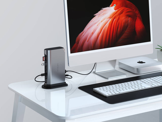 A Satechi Thunderbolt 4 Multimedia Pro Dock connected to an iMac on a desk, alongside a keyboard and a 2023 Mac mini.